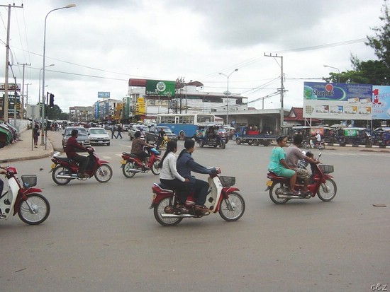 2432a- riding red in vientianne -- capital of laos